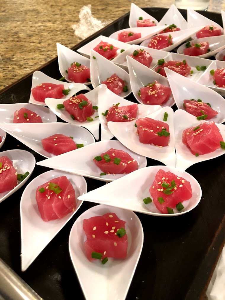 Ahi with ponzu sauce, sesame seed and chives in small appetizer cups