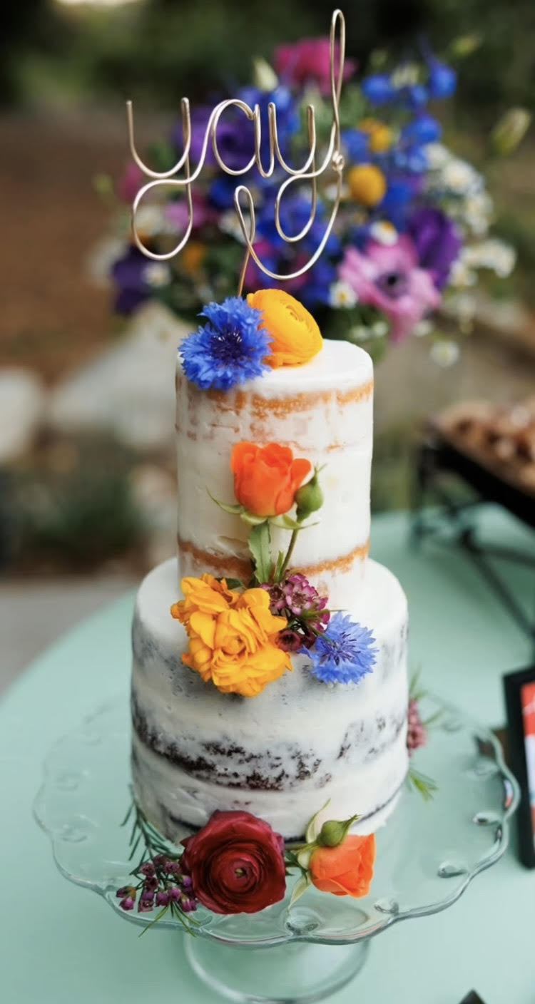 Picture of small whimsical wedding cake with  