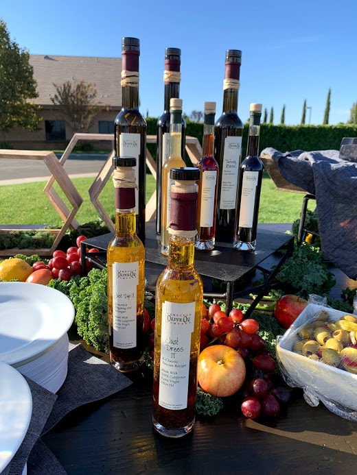 Picture of specialty olive oils and vinegars from the Temecula Olive Oil Company for a deluxe grazing table