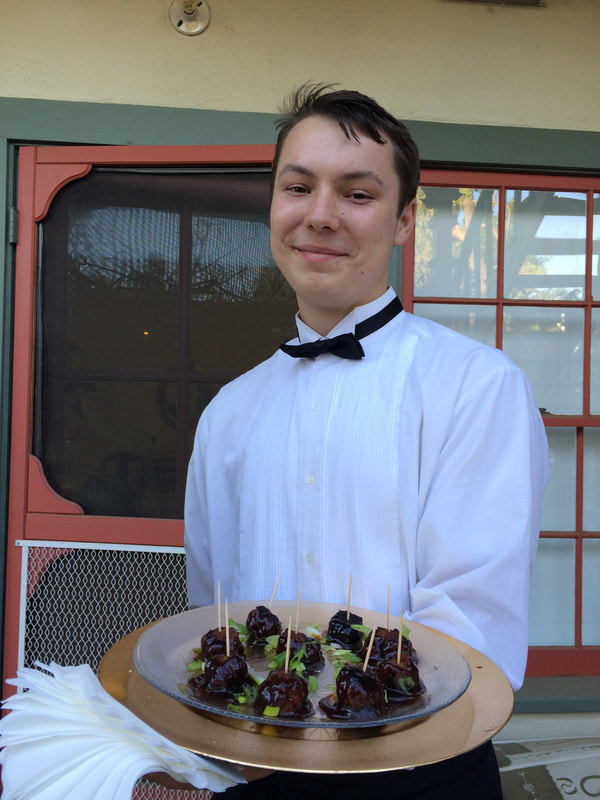 Waiter holding appetizers for tray-passing